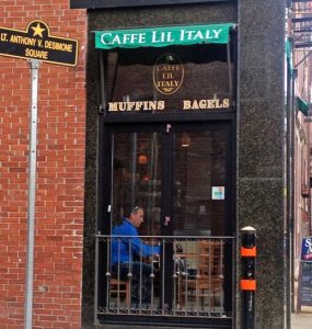 A customer relaxes at Caffe Lil Italy on Salem Street in the North End.